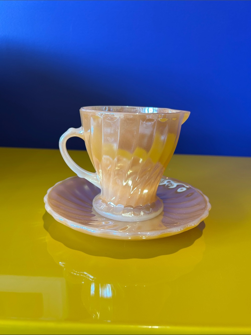 Fire King Peach Lustre pouring cup and plate in Swirl Pattern
